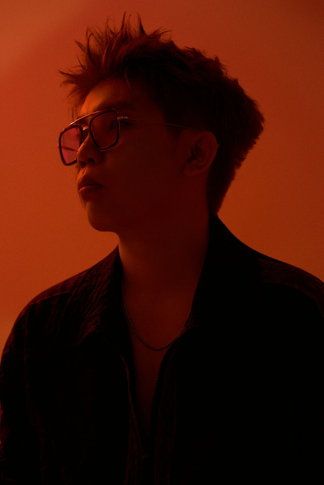 Studio portrait of a man with glasses