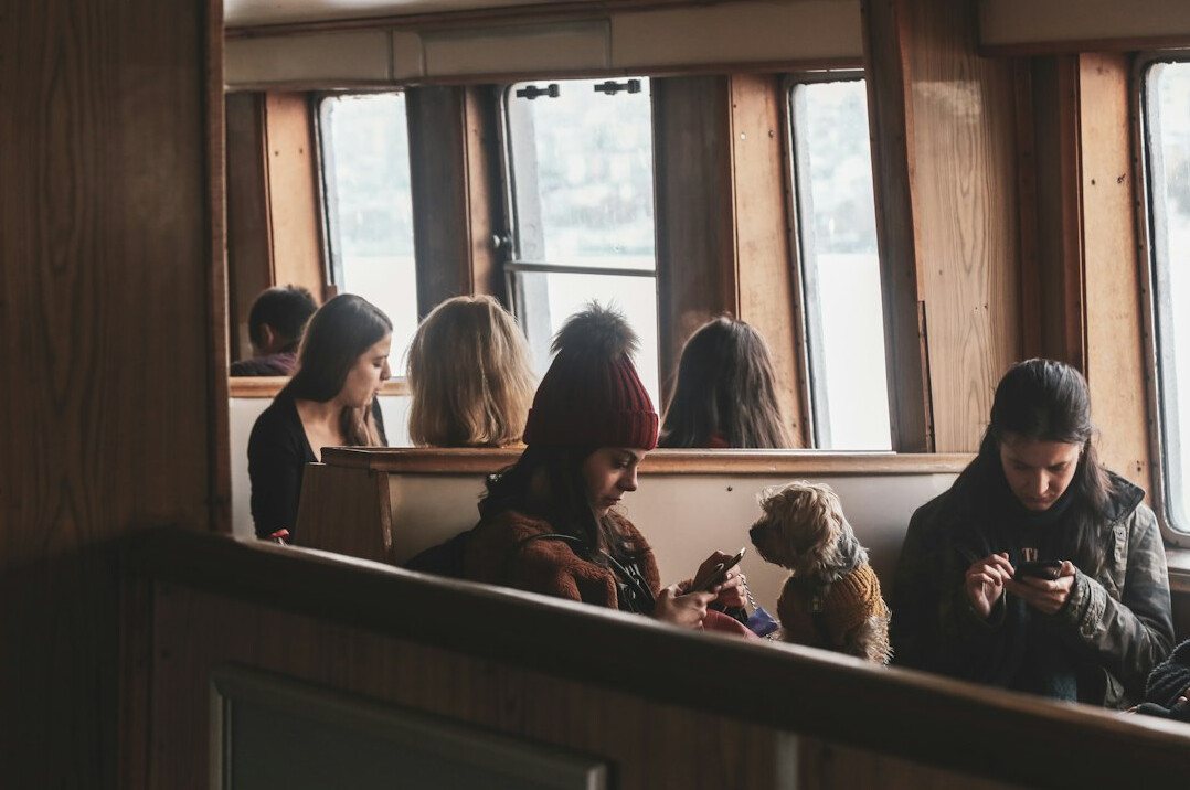 Small group of people looking at a laptop together