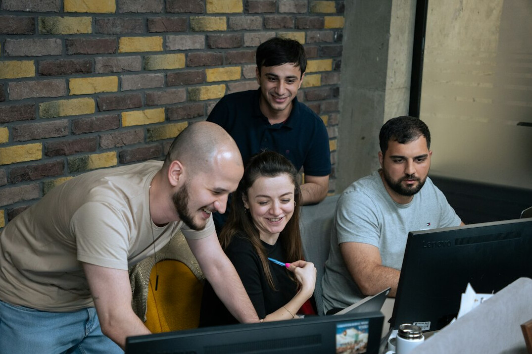 group of students discussing code